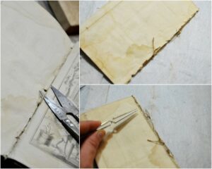 Démontage du cahier contenant les estampes afin de les nettoyer et de les mettre à plat.